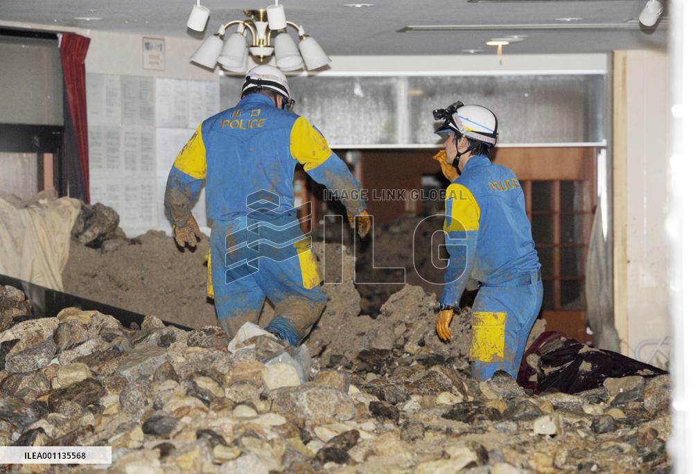 Rescue workers search for people missing in fatal mudslide