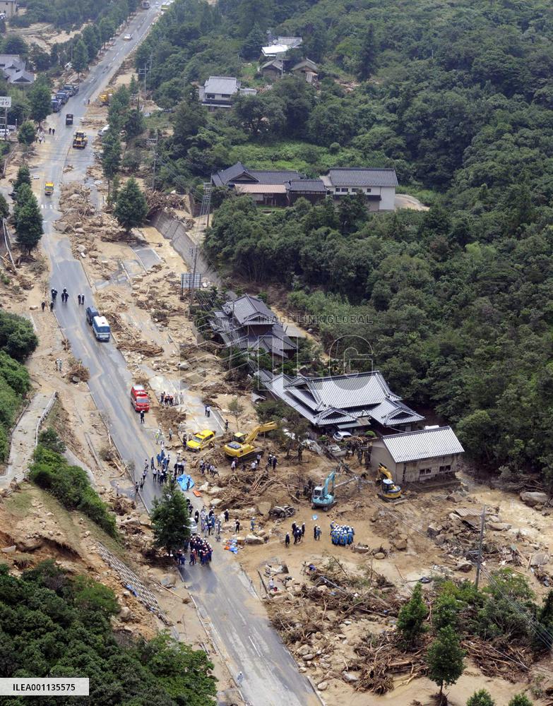 Rescue workers search for people missing in fatal mudslide
