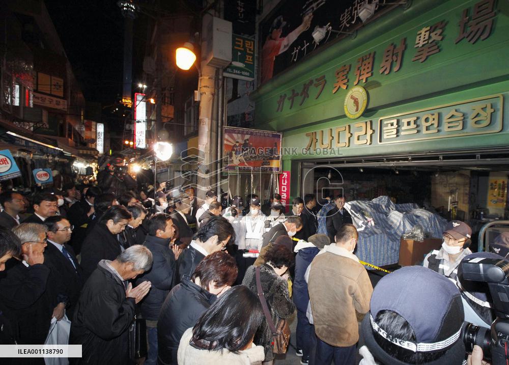 Families pray for victims in fire at Busan indoor shooting range