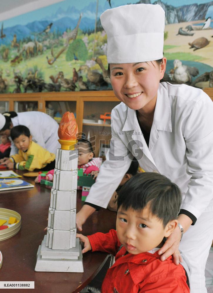 Child makes model of Juche Tower