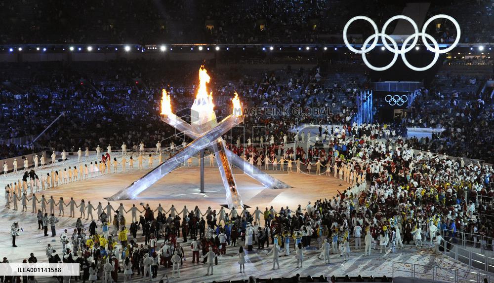 Olympic flame lit at opening ceremony