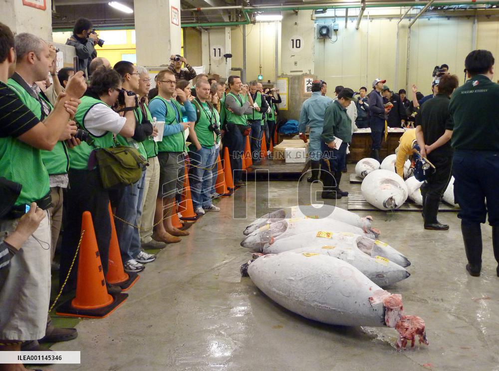 Tokyo's Tsukiji fish market reopens tuna auctions to sightseers