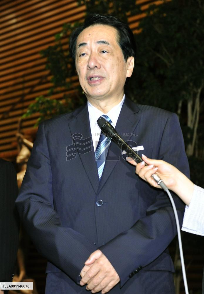 Kan speaks to reporters