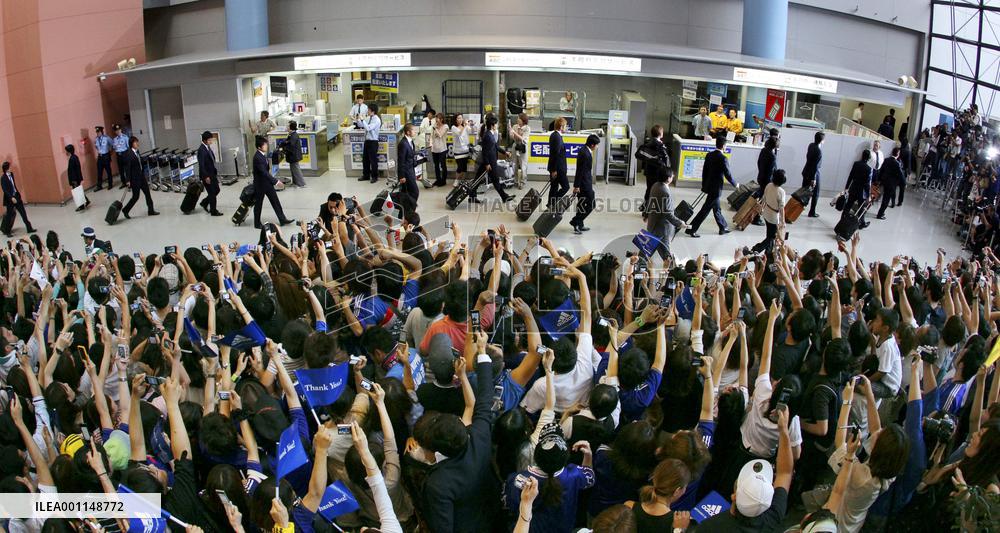 Japan's World Cup squad return home from South Africa