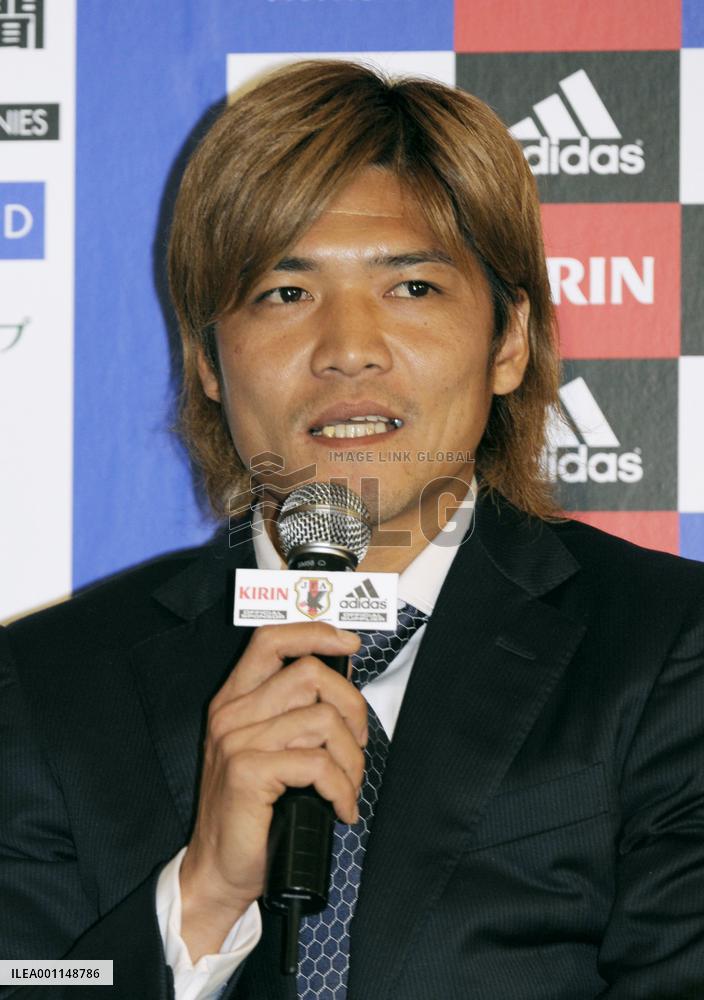 Japan's World Cup squad return home from South Africa