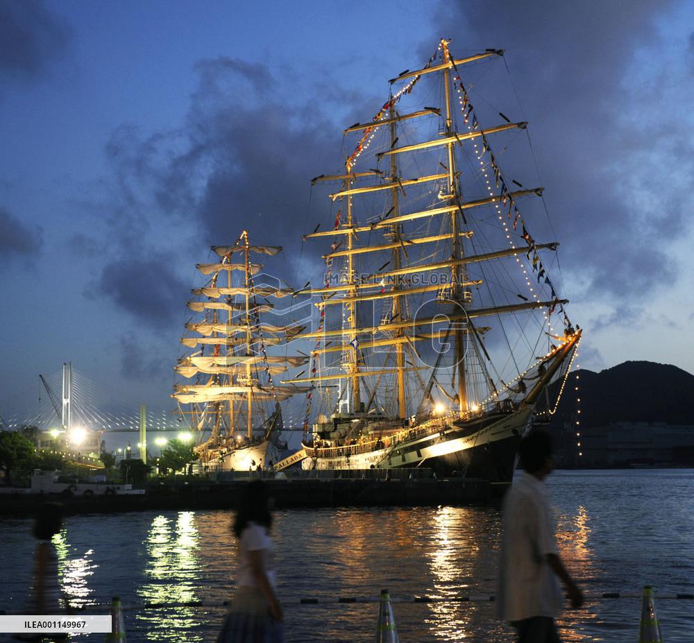Sail ships lit up in Nagasaki harbor