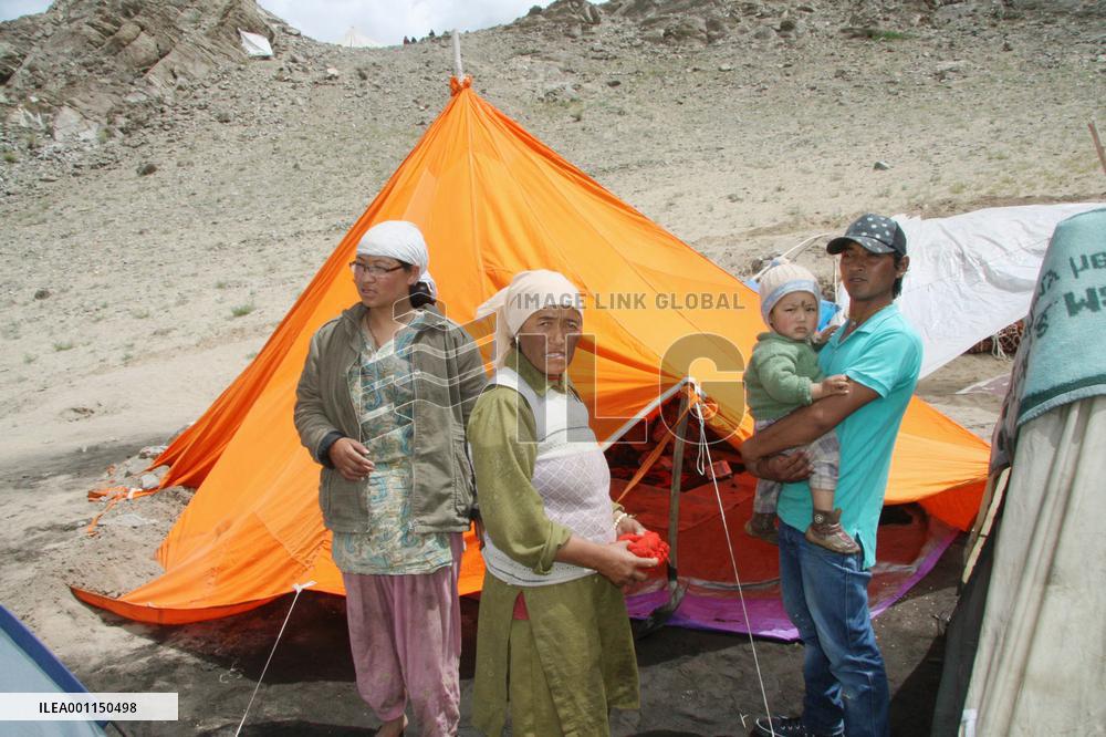 Flash flood victims in India at tent shelters