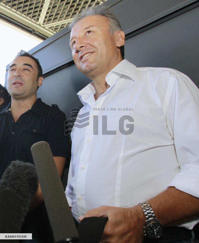 Soccer coach heads home for visa