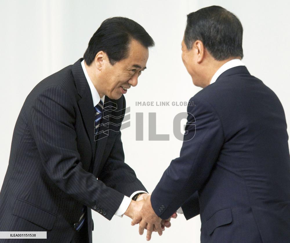 Kan keeps power beating Ozawa in election