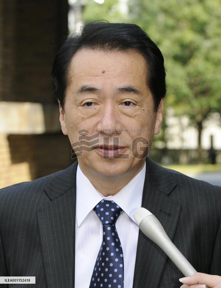 PM Kan speaks to reporters in Tokyo