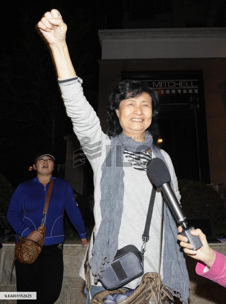 Woman celebrates as Liu awarded Nobel Peace Prize