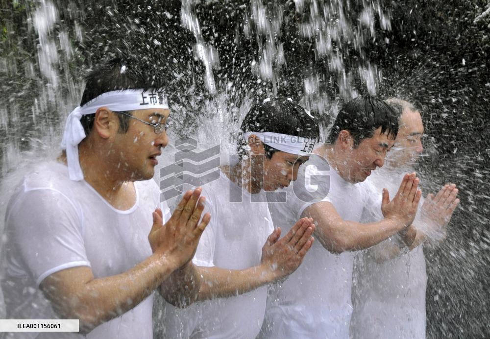 Ablutions under waterfall