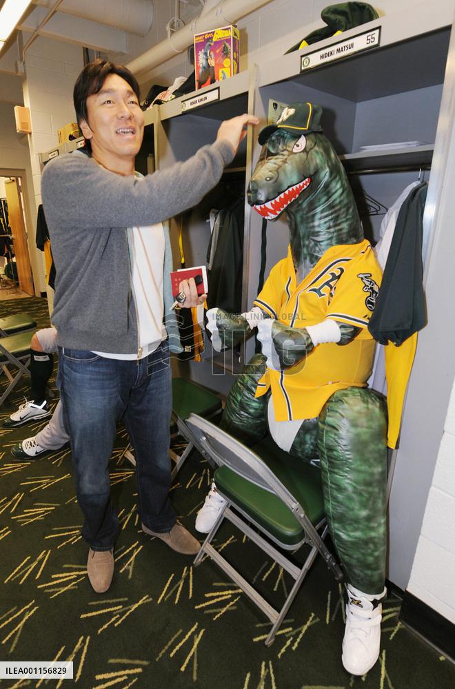 A's welcome Matsui with Godzilla figure