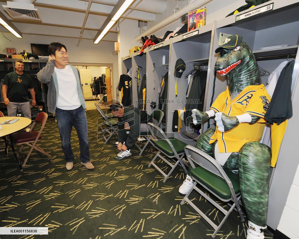 A's welcome Matsui with Godzilla figure