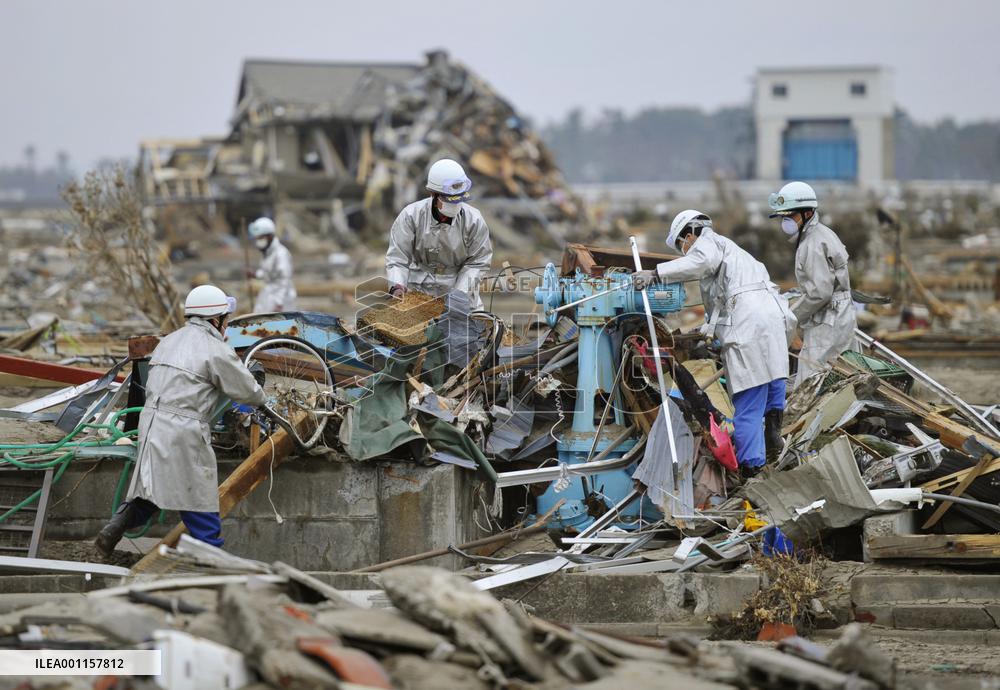 Searching for quake-tsunami victims