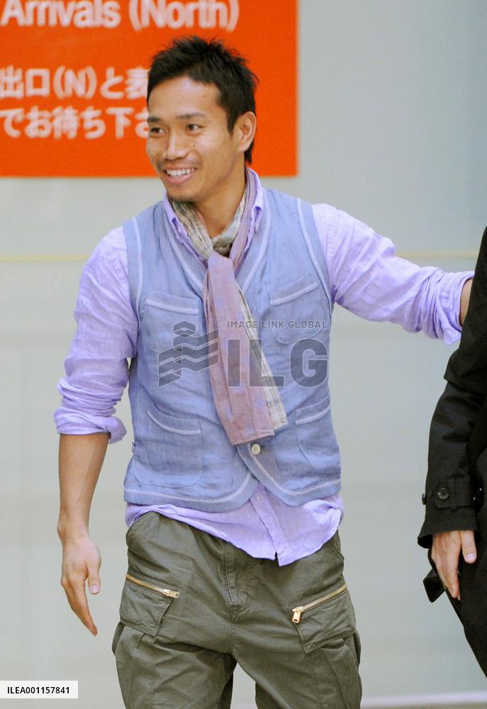 Nagatomo arrives in Japan for quake charity match