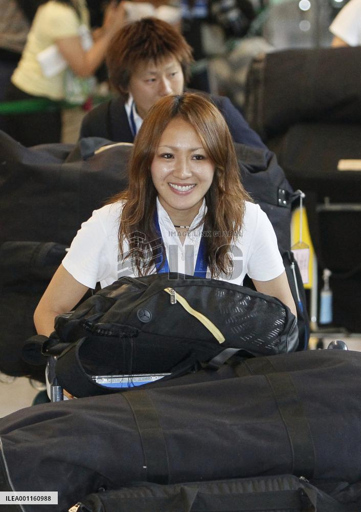 'Nadeshiko Japan' return home after victory