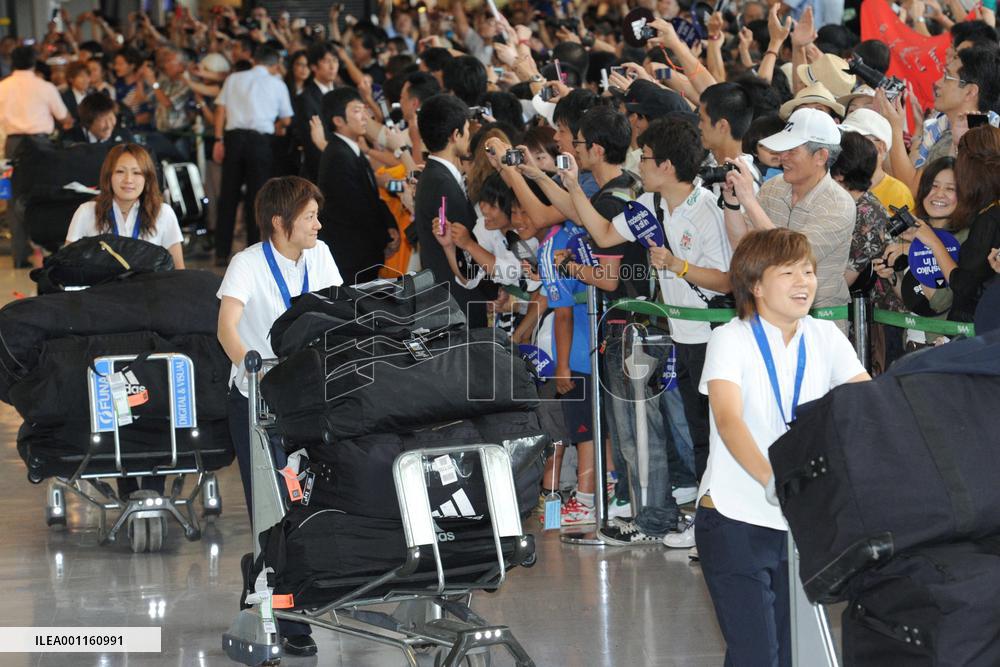 'Nadeshiko Japan' return home after victory