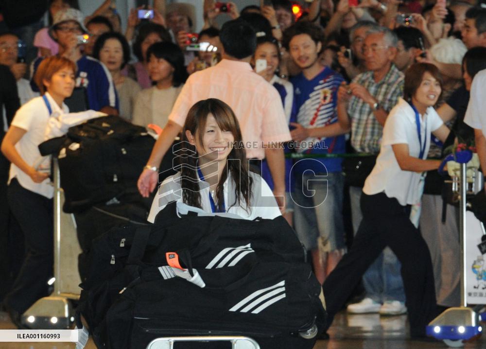 'Nadeshiko Japan' return home after victory