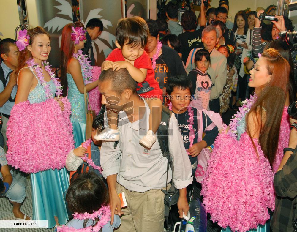 'Hula girls' greet guests at Fukushima spa resort reopening