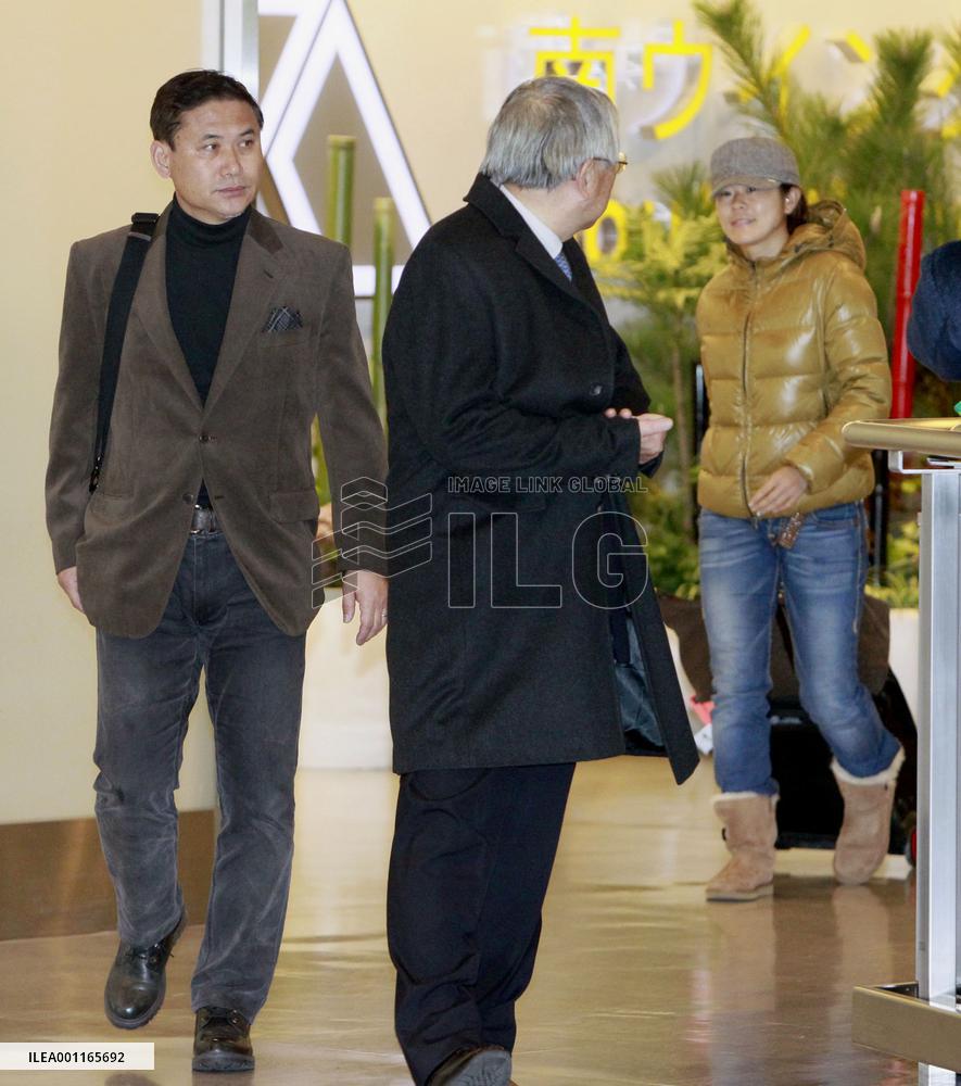 Women's soccer captain, coach return home