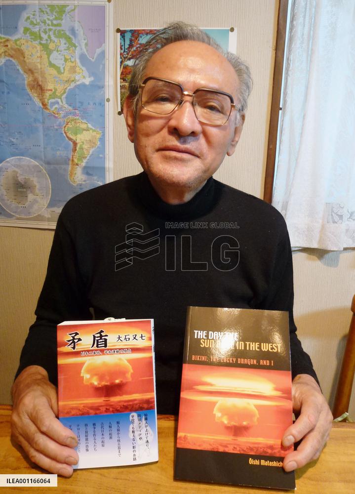 Ex-Lucky Dragon crewman Oishi with his new book