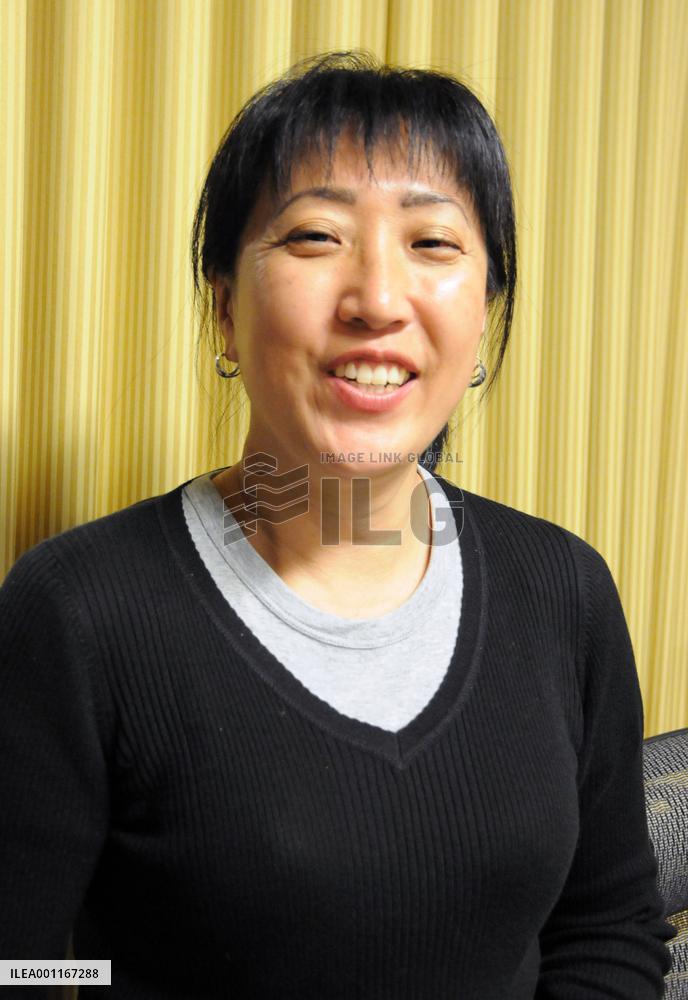 Woman bringing artificial legs to Rwandans