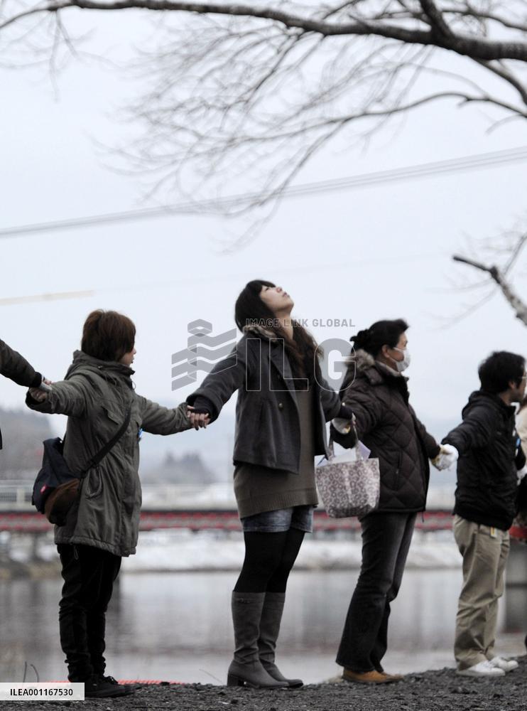 Holding hands in prayer