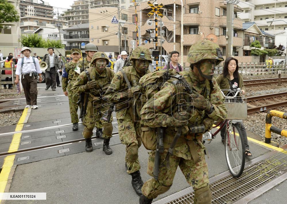 Armed GSDF troops march in Tokyo for drill