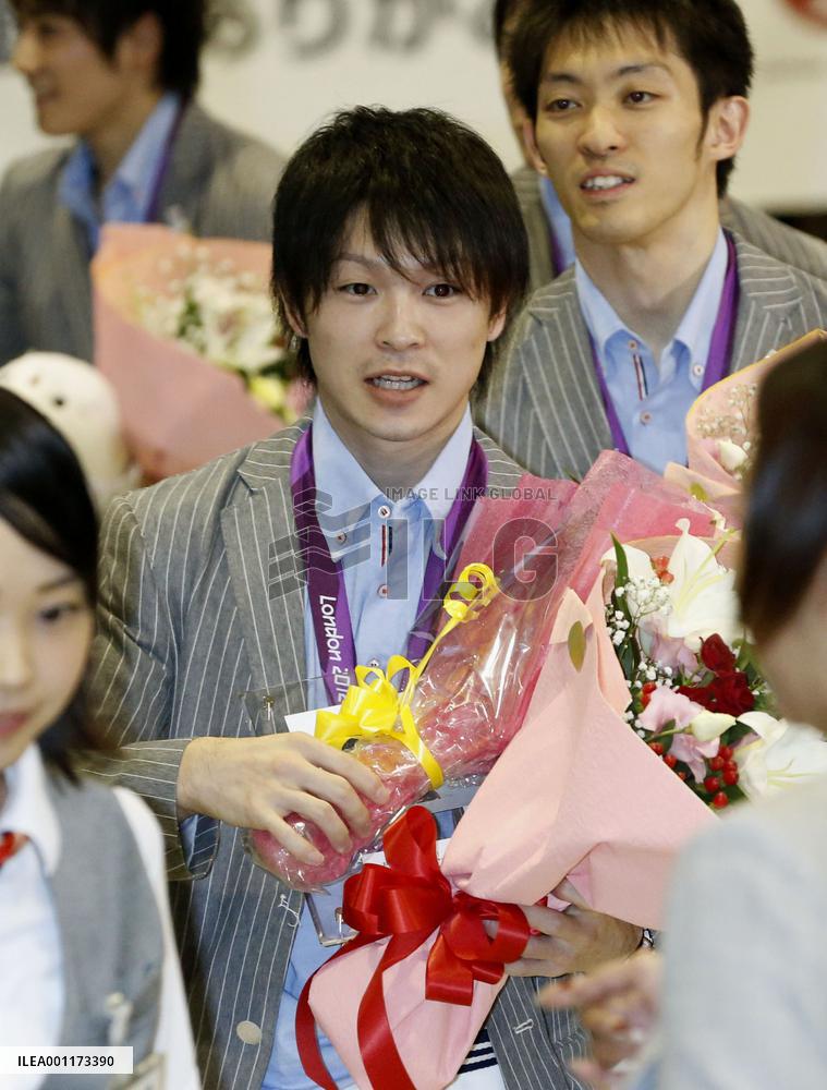 Gold medalist Uchimura returns home