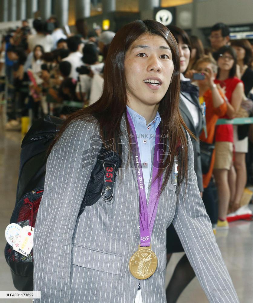 Japanese Olympic delegation arrives back in Japan