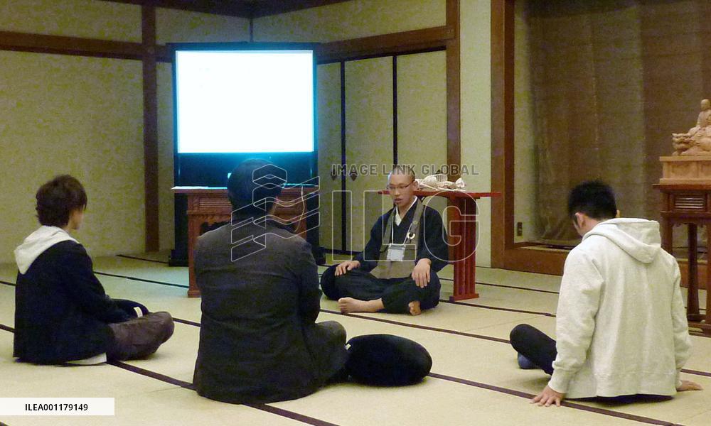 Buddhist priests preaching to struggling job seekers