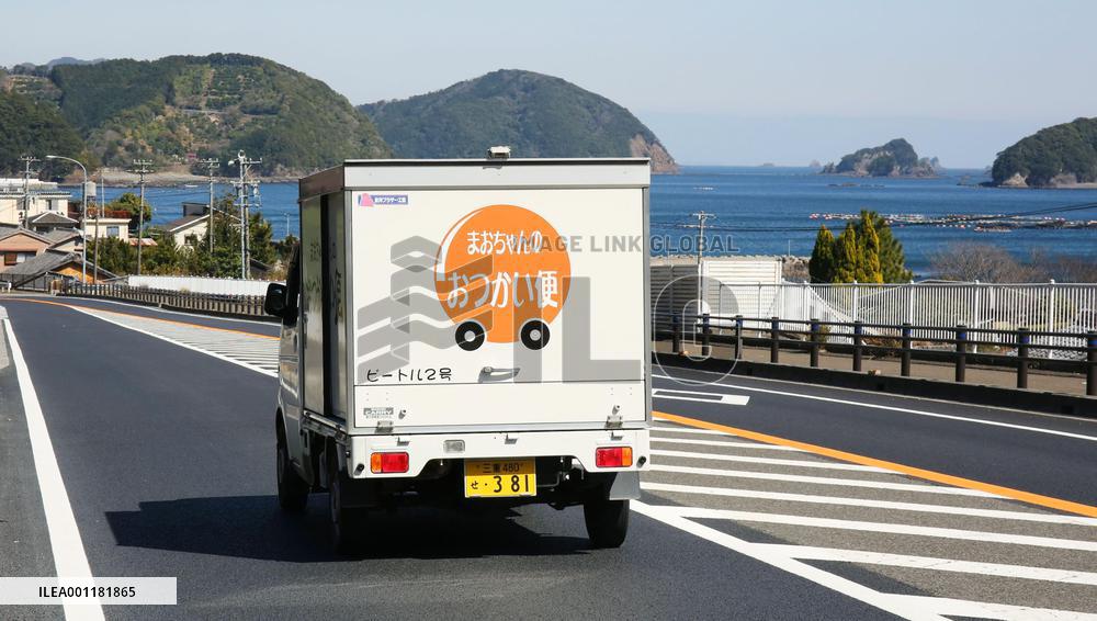 Young woman helps elderly in depopulated town