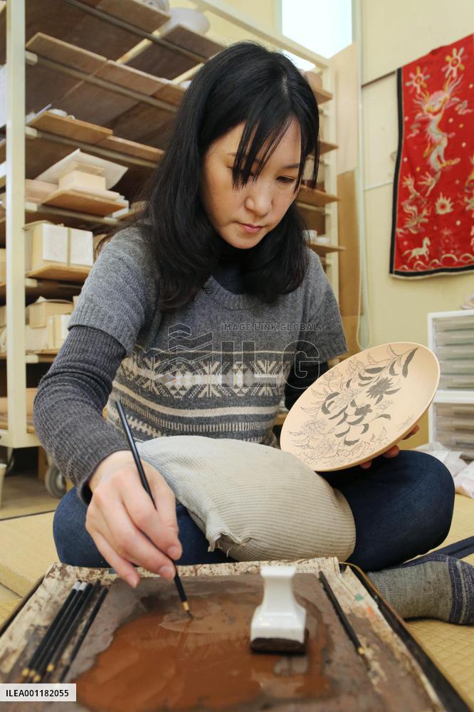 Middle-aged woman pursuing new career as porcelain artist