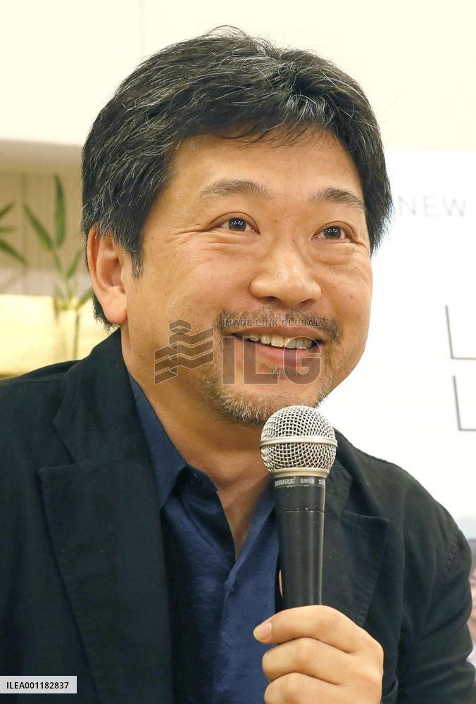 Film director Koreeda returns from Cannes