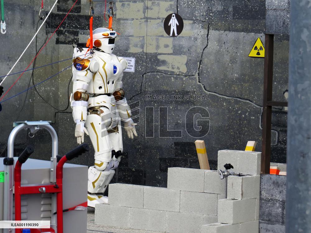 17 humanoid robots compete in DARPA Robotics Challenge