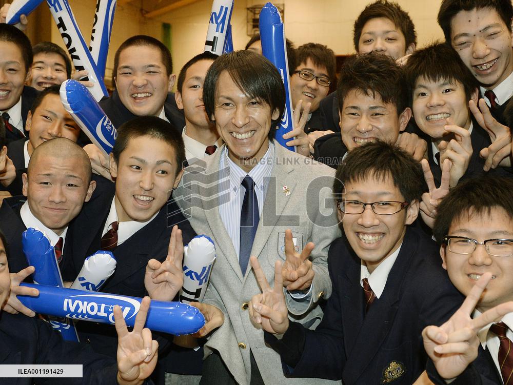 Ski jumper Kasai surrounded by students in Sapporo