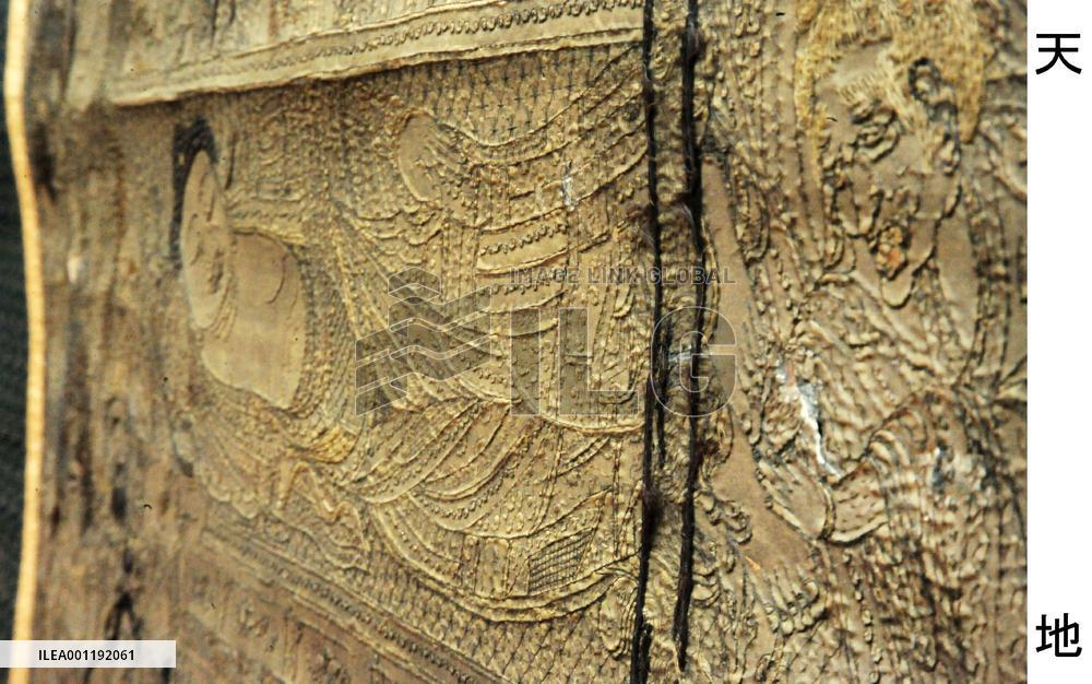 Buddha in nirvana in hair embroidery