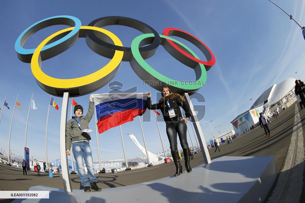 Holding Russian flag under Olympic rings