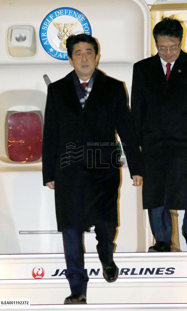 Abe returns from Sochi