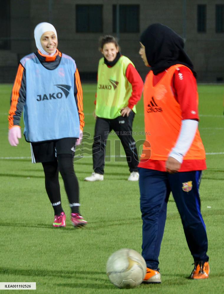 Jordanian women's soccer players wear headscarves