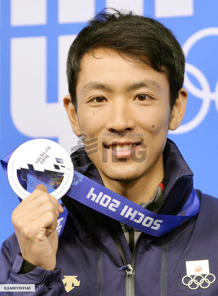 Japan's Nordic combined runner-up Watabe smiles with silver medal