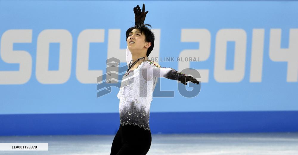 Japan's Hanyu skates in front of Sochi Olympic logo