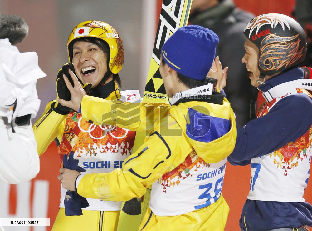 Japan's Kasai rejoices with teammates after winning large hill silver