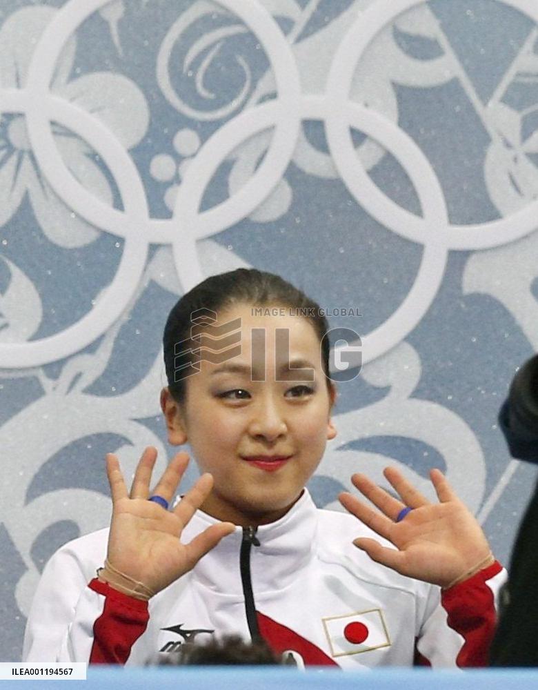 Japan's Asada responds to cheers after strong free program