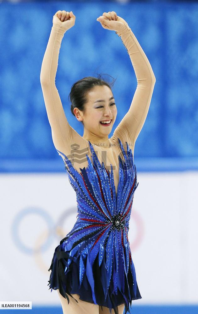 Japan's Asada smiles after hailed performance at Sochi