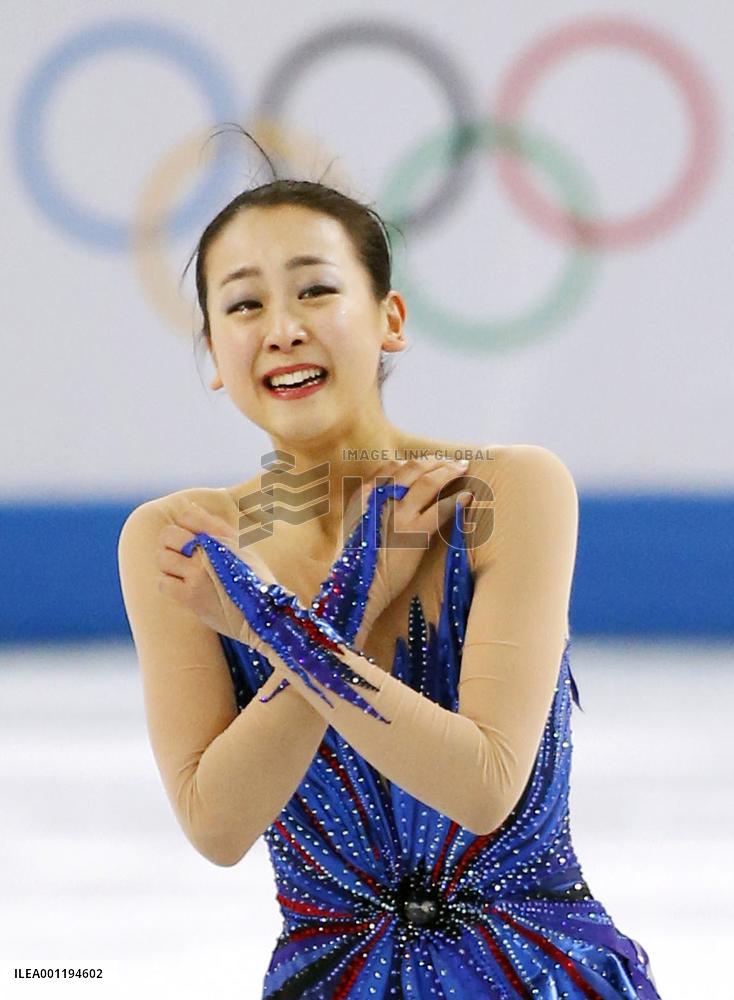 Japan's Asada smiles through tears after free program