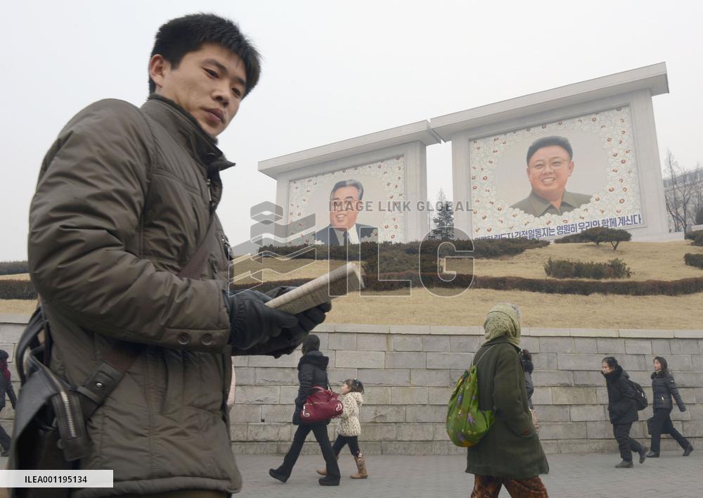 Citizens walk on street in Pyongyang, North Korea