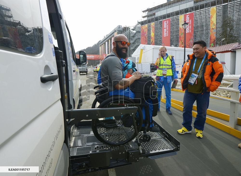 Greek athlete lifted onto vehicle at Sochi Paralympics