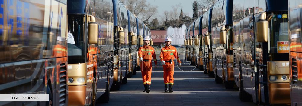 Firefighters patrol parking lot at Tiananmen Square
